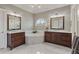 Elegant bathroom with double vanities, a soaking tub, and marble flooring at 3920 Ineal Dr, Cumming, GA 30028
