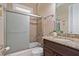 Well-lit bathroom features a shower over tub, granite countertops, and modern fixtures at 3920 Ineal Dr, Cumming, GA 30028