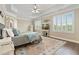 Spacious main bedroom featuring tray ceilings, hardwood floors, and beautiful natural light at 3920 Ineal Dr, Cumming, GA 30028