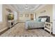 This main bedroom boasts tray ceilings, hardwood floors, and an entertainment area at 3920 Ineal Dr, Cumming, GA 30028