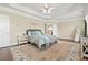 Serene main bedroom with a tray ceiling, neutral tones, and an elegant area rug at 3920 Ineal Dr, Cumming, GA 30028
