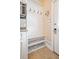 Mudroom features custom built-in bench with storage, convenient hooks, and direct outdoor access at 3920 Ineal Dr, Cumming, GA 30028