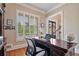 Bright office featuring hardwood floors, natural light from shuttered windows, and a classic executive desk at 3920 Ineal Dr, Cumming, GA 30028