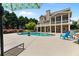 Backyard pool with lounge chairs surrounded by manicured landscaping at 3920 Ineal Dr, Cumming, GA 30028