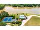 Aerial view of the community pool and tennis courts near a large lake at 4810 Duncans Lake Dr, Buford, GA 30519