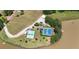 Aerial view of the community amenities next to a lake at 4810 Duncans Lake Dr, Buford, GA 30519