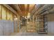 Unfinished basement with exposed ductwork, shelving, and a partially framed room at 4810 Duncans Lake Dr, Buford, GA 30519