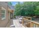 Back deck with an outdoor seating area overlooking a wooded area at 4810 Duncans Lake Dr, Buford, GA 30519