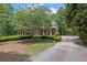 Charming brick home exterior with well-manicured landscaping and a private driveway at 4810 Duncans Lake Dr, Buford, GA 30519