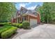 Beautiful two-story brick home showcasing an attached garage and a well-maintained yard at 4810 Duncans Lake Dr, Buford, GA 30519