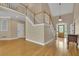 Staircase and foyer showcasing high ceilings, hardwood floors, and natural light at 4810 Duncans Lake Dr, Buford, GA 30519
