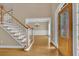 Grand foyer with hardwood floors, staircase, and decorative front door at 4810 Duncans Lake Dr, Buford, GA 30519