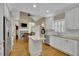 Bright eat-in kitchen boasts stainless appliances, an island, and adjacent breakfast nook at 4810 Duncans Lake Dr, Buford, GA 30519