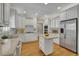 Spacious kitchen featuring a center island, stainless steel appliances, and ample storage at 4810 Duncans Lake Dr, Buford, GA 30519