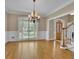 Bright living room with hardwood floors and shuttered windows at 4810 Duncans Lake Dr, Buford, GA 30519