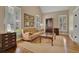 Comfortable living room featuring natural light, classic decor, and hardwood floors at 4810 Duncans Lake Dr, Buford, GA 30519