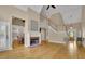 Open floor plan with living room, fireplace, and views into kitchen and entry at 4810 Duncans Lake Dr, Buford, GA 30519