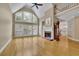 Spacious living room features high ceilings, fireplace, and large windows at 4810 Duncans Lake Dr, Buford, GA 30519