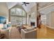 Bright living room with vaulted ceilings, large windows, and a cozy fireplace at 4810 Duncans Lake Dr, Buford, GA 30519