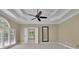 Spacious main bedroom features large windows, a ceiling fan, and neutral décor at 4810 Duncans Lake Dr, Buford, GA 30519