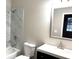 Bathroom featuring tiled shower and tub combination and modern vanity at 5091 Newark Ave, Clarkdale, GA 30111