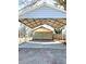 Carport featuring a metal roof and concrete pad, providing ample space for parking at 5091 Newark Ave, Clarkdale, GA 30111