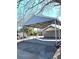 Functional carport with metal roof offers convenient parking next to the home at 5091 Newark Ave, Clarkdale, GA 30111