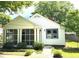 Beautiful home with a cozy screened in porch and traditional architectural details at 5091 Newark Ave, Clarkdale, GA 30111