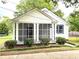 Charming home featuring a screened-in porch and well-maintained landscaping at 5091 Newark Ave, Clarkdale, GA 30111