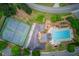 Aerial view of community amenities with tennis courts, pool, and playground area at 512 Antler Ln, Suwanee, GA 30024