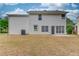 The back exterior of the home showcases a well-maintained lawn and neutral siding at 512 Antler Ln, Suwanee, GA 30024