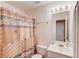 Bathroom featuring a decorative shower curtain and a well-lit mirror with white cabinets at 512 Antler Ln, Suwanee, GA 30024