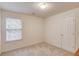 Neutral bedroom with a window and ample space, providing a blank canvas at 512 Antler Ln, Suwanee, GA 30024