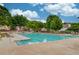 Community pool and deck with lounge chairs, offering a relaxing outdoor space at 512 Antler Ln, Suwanee, GA 30024
