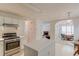 Bright kitchen boasts an island, stainless steel appliances and opens to breakfast nook at 512 Antler Ln, Suwanee, GA 30024