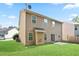 Backyard featuring a lush green lawn and a patio at 5244 Carrington Park Dr, Powder Springs, GA 30127