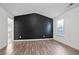 Bedroom boasting high ceilings, a large window, and wood-look flooring at 5244 Carrington Park Dr, Powder Springs, GA 30127