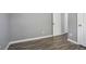 Bedroom featuring laminate flooring, white walls, and white trim at 5244 Carrington Park Dr, Powder Springs, GA 30127