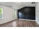 Bedroom featuring high ceilings, two large windows, and modern interior design at 5244 Carrington Park Dr, Powder Springs, GA 30127