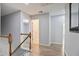 Hallway featuring laminate flooring, neutral walls, and white trim at 5244 Carrington Park Dr, Powder Springs, GA 30127