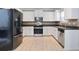Modern kitchen featuring stainless steel appliances, white cabinets, and updated countertops at 5244 Carrington Park Dr, Powder Springs, GA 30127