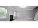 Comfortable living room featuring a fireplace, and natural light from multiple windows at 5244 Carrington Park Dr, Powder Springs, GA 30127