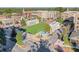 Aerial shot of a charming mixed-use community featuring a vibrant green space and pedestrian-friendly streets at 12084 Cotton Aly, Alpharetta, GA 30009