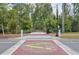 A vibrant Alpha Loop crosswalk enhances community connectivity and promotes pedestrian-friendly access to amenities at 12084 Cotton Aly, Alpharetta, GA 30009