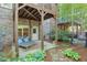 Picturesque backyard featuring stone accents, lounge chairs, and a private patio area at 12084 Cotton Aly, Alpharetta, GA 30009