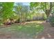 Spacious backyard with mature trees and lush lawn, perfect for outdoor activities and relaxation at 12084 Cotton Aly, Alpharetta, GA 30009