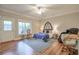 Spacious bedroom featuring an exterior door, plenty of natural light, and a luxury massage chair at 12084 Cotton Aly, Alpharetta, GA 30009