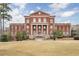 Impressive brick building with stately columns offers a timeless and elegant community landmark at 12084 Cotton Aly, Alpharetta, GA 30009