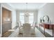 Elegant dining room featuring a chandelier, hardwood floors, and classic decor at 12084 Cotton Aly, Alpharetta, GA 30009