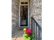 Welcoming entryway featuring a view of the staircase and brickwork at 12084 Cotton Aly, Alpharetta, GA 30009